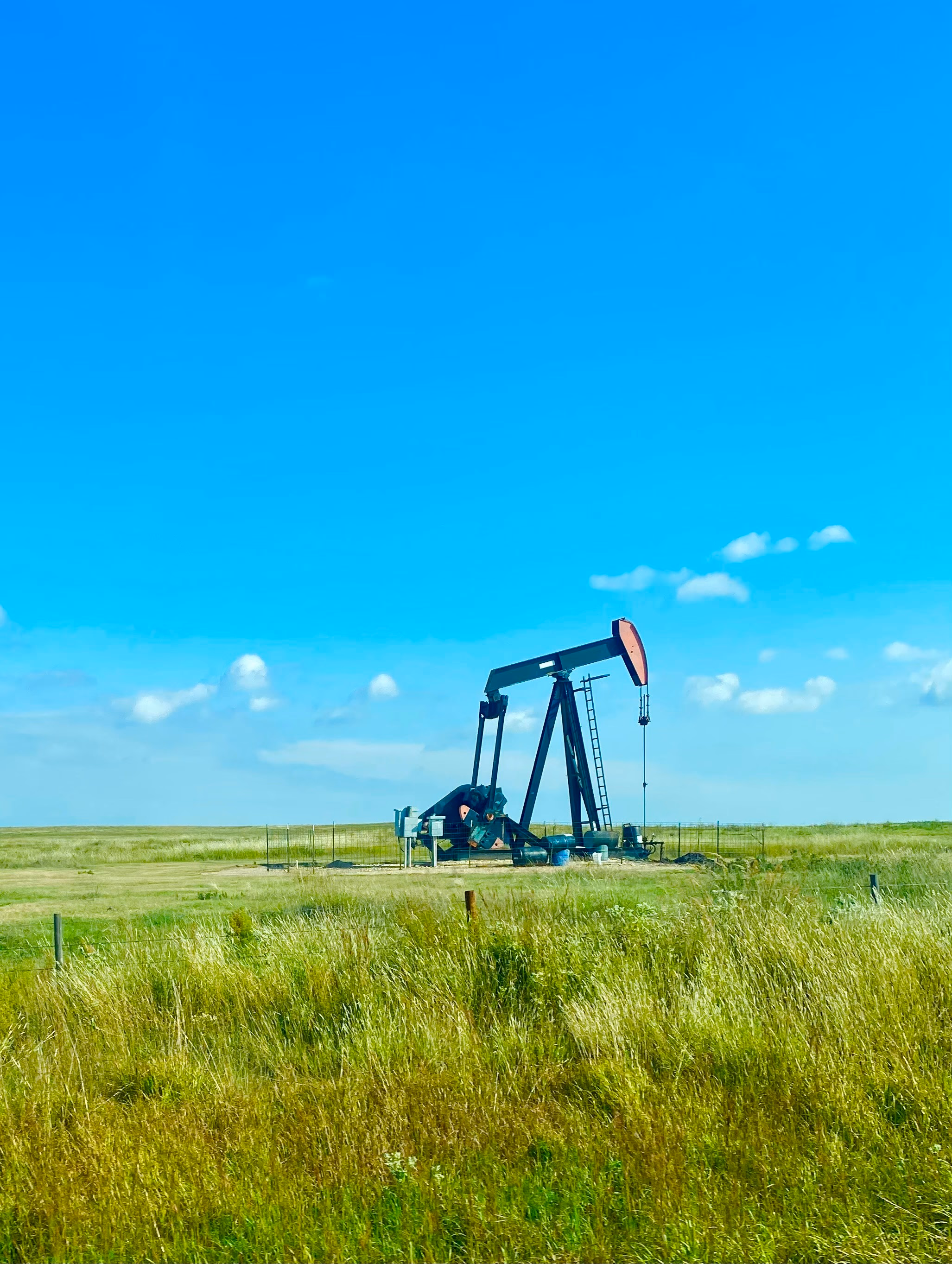Oil rig in an open field